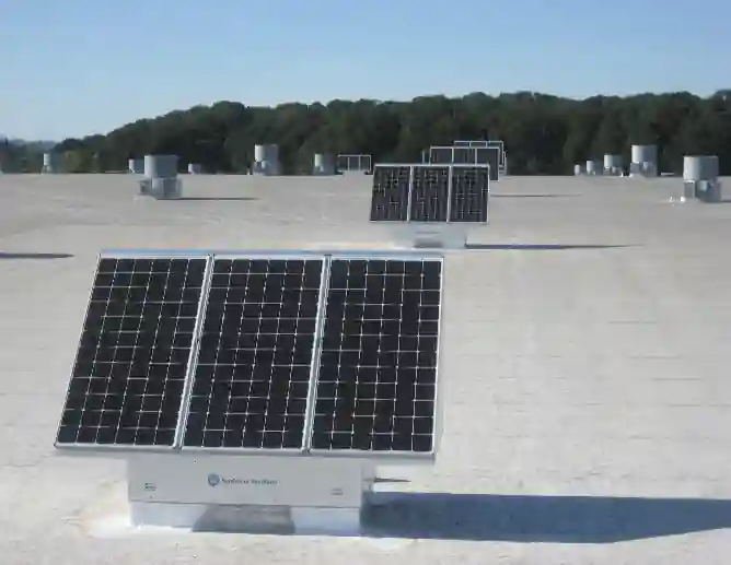 SunCooler rooftop units replacing legacy exhaust fans on high-bay facility