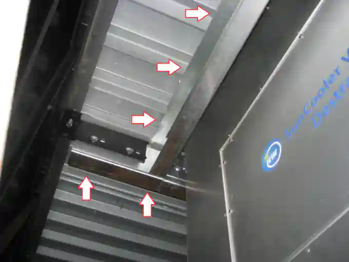 Dropping SunCooler into roof opening on high-bay commercial facility